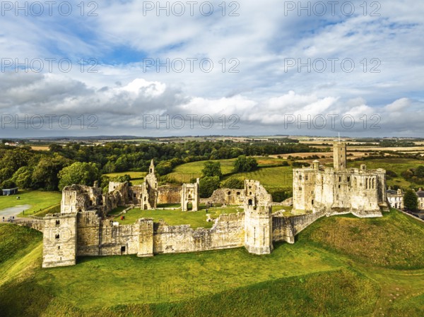 Warkworth Castle over River Coquet from a drone, Warkworth, Northumberland, England, United Kingdom