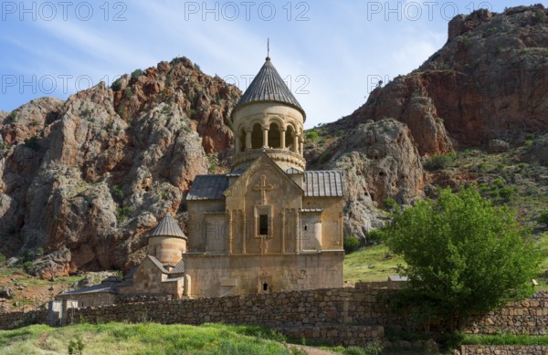 Church with dome in picturesque mountain scenery, surrounded by rocks, Noravank monastery, Surb Astvatsatsin mausoleum church and Surb Karapet baptism church, Noravank, Vayots Dzor province, Wajoz Dzor, Armenia, Caucasus