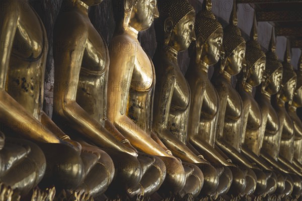 Gilded Buddha statues (Bhumispara mudra: Buddha Gautama at the moment of enlightenment), Wat Suthat Thepwararam, Royal Temple, Phra Nakhon, Bangkok, Thailand