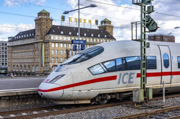 ICE train on track 2 in Essen main station, view of the city center, Handelshof building with Essen lettering, North Rhine-Westphalia, Germany