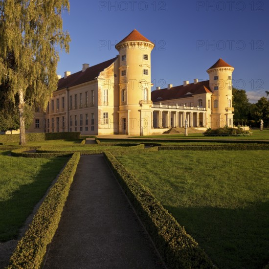 Rheinsberg Castle, front in late evening light, prime example of Friederician Rococo, Ruppiner Land, Brandenburg, Germany