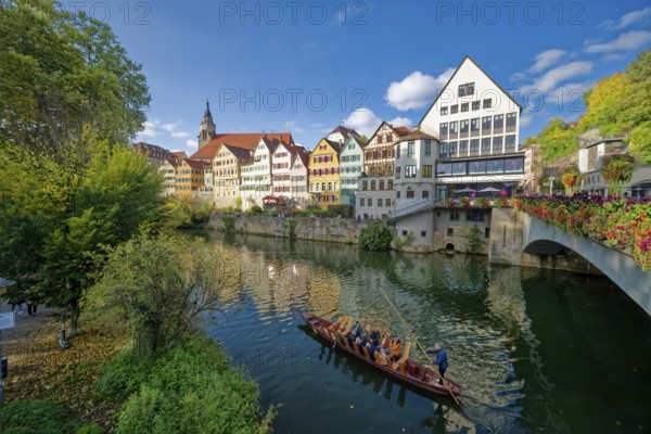 Historic houses on the Neckar front, the Neckar river with poking and water reflection, old town of Tübingen, Baden-Württemberg, Germany