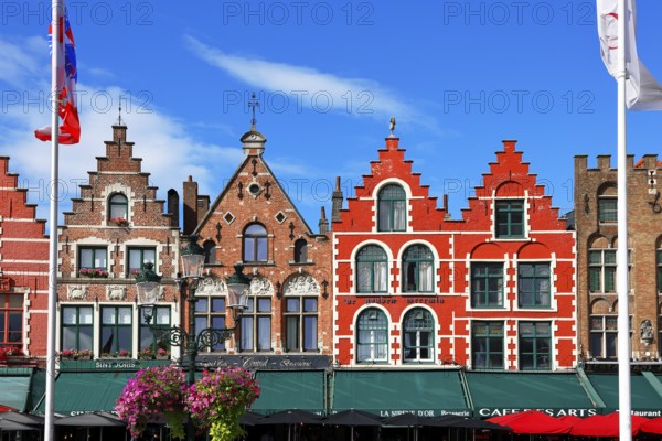 Historic houses on the market square in the old town of Bruges, Grote Markt, former guild houses, now restaurants and cafes, UNESCO World Heritage Site, Flanders, Belgium