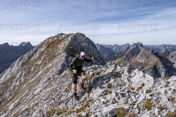 Hikers on steep Gradweg, hiking to Gamsjoch, eastern Karwendel, Tyrol, Austria