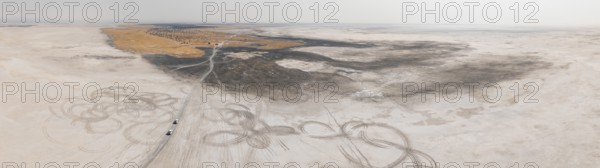 Aerial view, tire tracks on a salt pan, arid landscape, Botswana