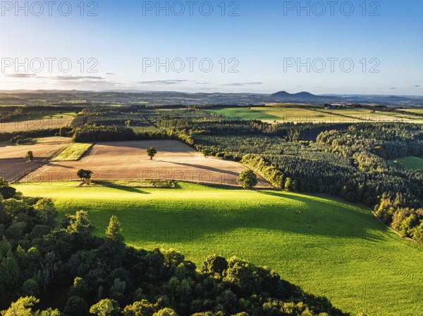 Fields and Farms over River Teviot and Minto Crags from a drone, Roxburghshire, Scottish Borders, Scotland, UK