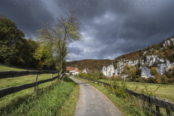 Käppeler estate with St. George's Basilica near Thiergarten in the upper Danube Valley, surrounded by autumn vegetation, Sigmaringen district, Baden-Württemberg, Germany