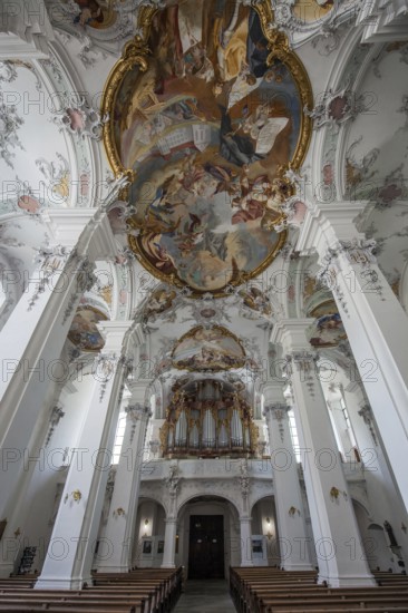 St. George and James Catholic Church, interior view, nave with ceiling frescoes and organ, Isny, Allgäu, Baden-Württemberg, Germany