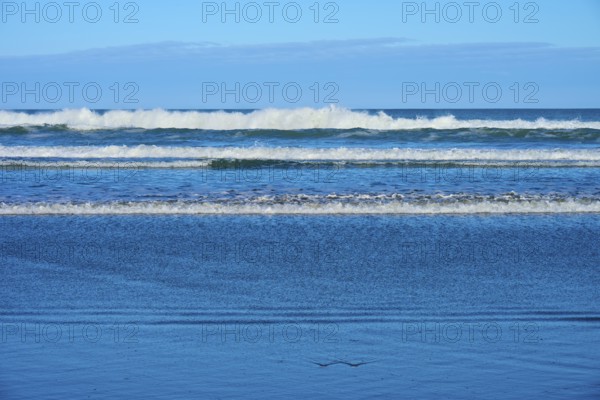 Gentle waves meet the beach, sky and sea in harmony, Spencer Park Beach, Spencerville, Christchurch, New Zealand South Island, New Zealand