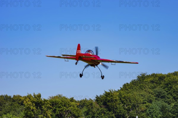 A Soviet Jakovlev Jak-55 sport aircraft with the registration LY-TOY during a flight demonstration as part of an air show on Rossfeld in Metzingen-Glems, Baden-Württemberg, Germany, for editorial use only