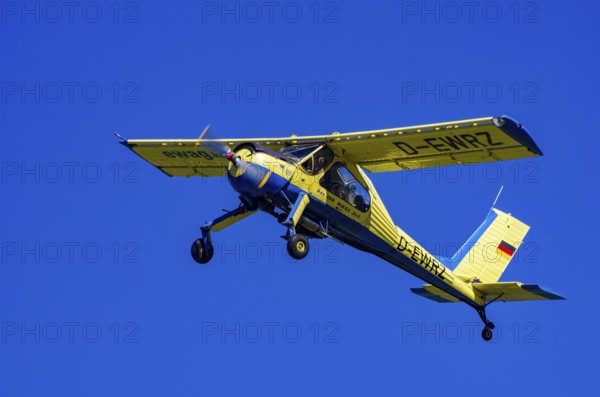 A PZL-104 Wilga-35A sport aircraft from Fliegerklub Kamenz with registration D-EWRZ during a flight demonstration as part of an air show on Rossfeld in Metzingen-Glems, Baden-Württemberg, Germany, for editorial use only