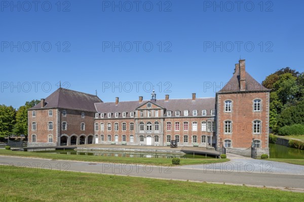16th century Classicist Château de Franc-Waret in Louis XV style, moated castle in the village Fernelmont, province of Namur, Wallonia, Belgium