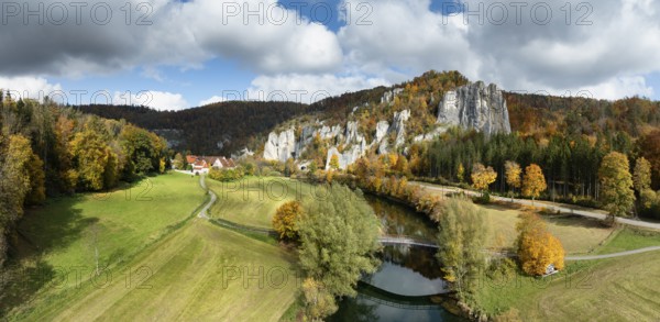 Aerial view, panorama of Käppeler estate with the St. George's Basilica near Thiergarten in the upper Danube Valley, surrounded by autumn vegetation, on the right the raven rocks, climbing rocks, Jura limestone rocks, Sigmaringen district, Baden-Württemberg, Germany