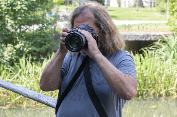 Photographer taking pictures, Amberg, Upper Palatinate, Bavaria, Germany