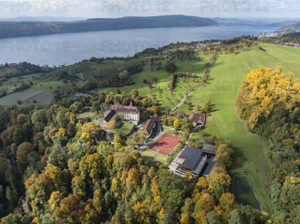Aerial view of Lake Constance, Überlinger See, surrounded by autumn vegetation with Spetzgart Castle, Salem International College, Bodanrück on the horizon, Lake Constance District, Baden-Württemberg, Germany