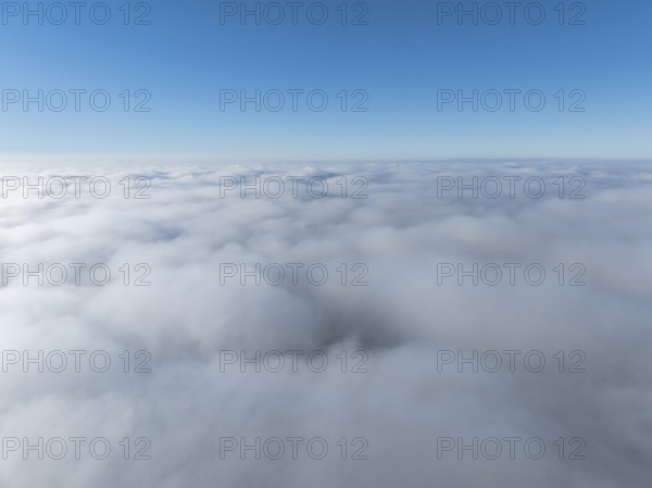 Aerial view, clouds of fog, fog cover seen from above, with clear blue sky, Germany