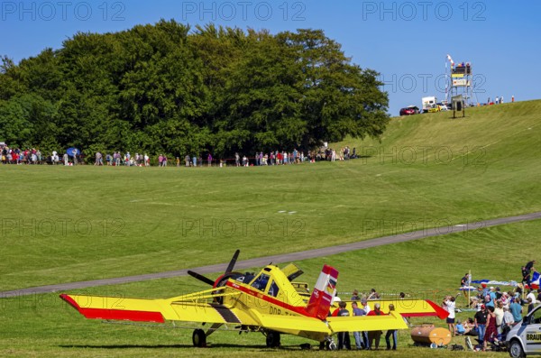 A PZL-106 AR Kruk agricultural aircraft with the registration D-FOAB and the original registration DDR-TAB as well as in the original colors of the company Agrarflug of Interflug as part of an air show on Rossfeld in Metzingen-Glems, Baden-Württemberg, Germany, for editorial use only