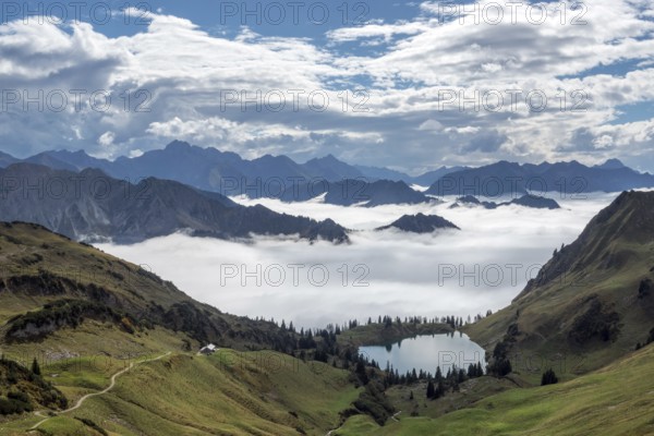 View of Seealpsee and Allgäu Alps, mountains rising from fog in the valley, Nebelhorn, Oberstdorf, Oberallgäu, Allgäu, Bavaria, Germany
