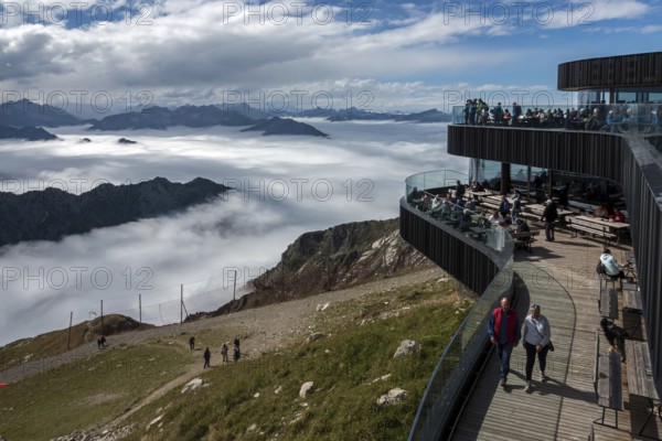 Restaurant at the Nebelhorn summit with views of the Allgäu Alps, mountains rising from fog in the valley, Oberstdorf, Oberallgäu, Allgäu, Bavaria, Germany