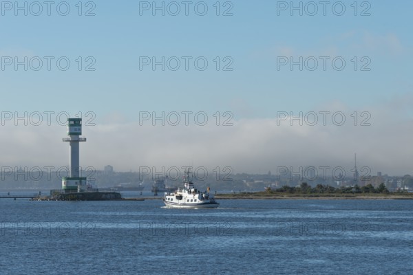 Green-white lighthouse Friedrichsort with city panorama of the state capital, Kiel Fjord, Kiel, haze bell, shipping, tower, architecture, landmark, orientation, navigation, shipping, blue sky, Schleswig-Holstein, Germany