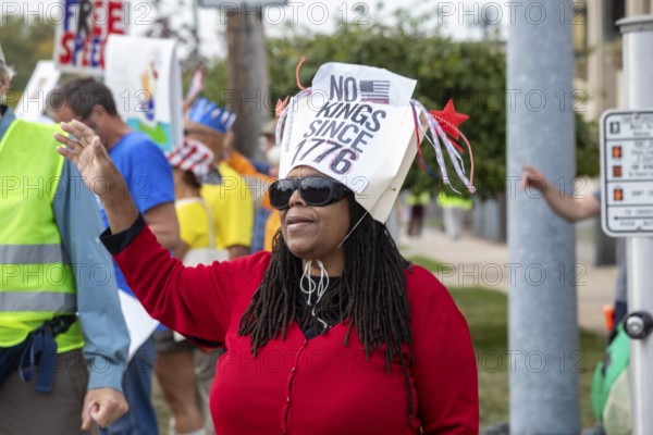 Detroit, Michigan USA - 18 October 2025 - Protesters from Detroit and Grosse Pointe gathered on the border between their cities for a 'No Kings' rally, protesting President Trump's actions against immigrants and against democratic institutions