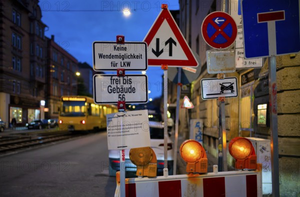 Sign forest, several traffic signs, construction site, stopping ban, dead end, oncoming traffic, subway, light rail, blue hour, dusk, Böblinger Straße, Stuttgart, Baden-Württemberg, Germany