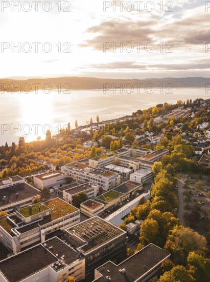 Sunlight floods an urban landscape with views of the lake and surrounding buildings, Überlingen, Lake Constance, Germany