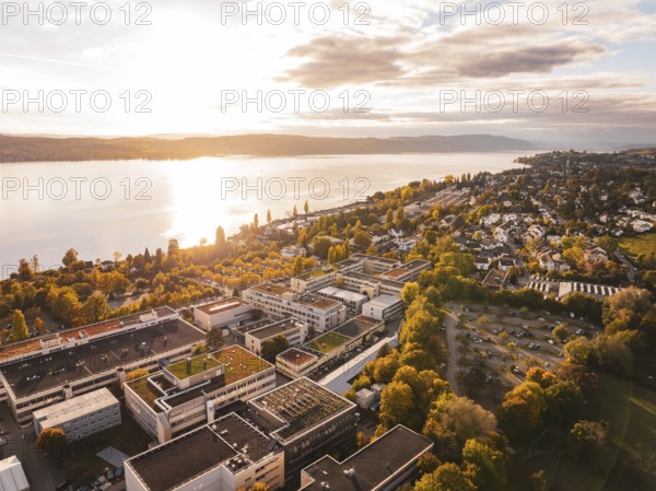 An aerial view of a waterside city surrounded by an autumn landscape, Überlingen, Lake Constance, Germany