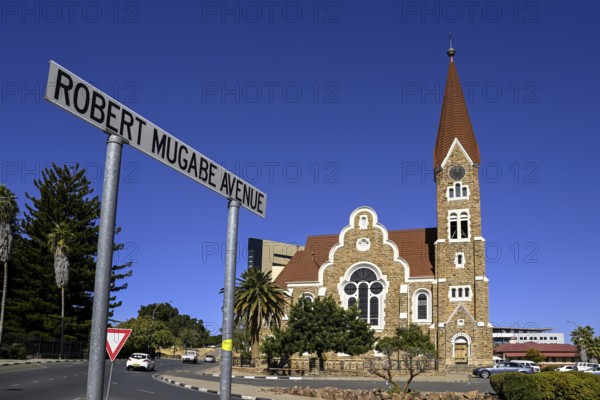 Robert Mugabe Avenue sign in front of the 1910 Evangelical Lutheran Christ Church, Windhoek, Khomas region, Namibia