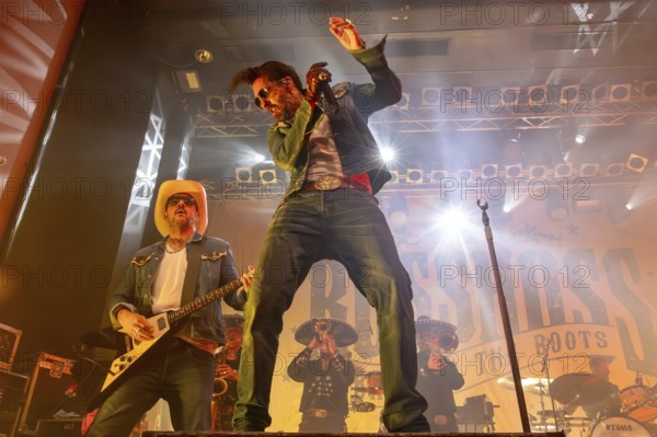 Stefan Bühler (Russ T. Rocket), guitarist, and Alec Völkel (Boss Burns), singer of the band The BossHoss on their Back To The Boots Tour 2025 at Capitol Hannover on 3 October 2025