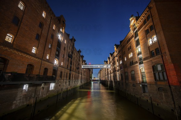 Illuminated warehouses in Hamburg's Speicherstadt, blue hour, Hamburg, Germany