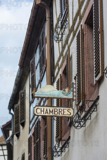 Historic guild sign of a guesthouse in the old town centre of Kaysersberg