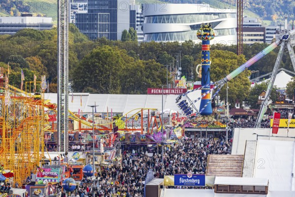 The 178th Cannstatter Volksfest on the Wasen attracted 4.2 million visitors. The Wasenrummel is one of the most important traditional festivals in Germany. In the background is the headquarters of Mercedes-Benz Group AG. Bad Cannstatt, Stuttgart, Baden-Württemberg, Germany