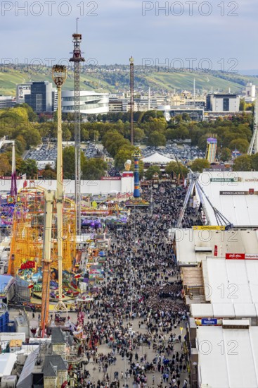 The 178th Cannstatter Volksfest on the Wasen attracted 4.2 million visitors. The Wasenrummel is one of the most important traditional festivals in Germany. In the background is the headquarters of Mercedes-Benz Group AG. Bad Cannstatt, Stuttgart, Baden-Württemberg, Germany