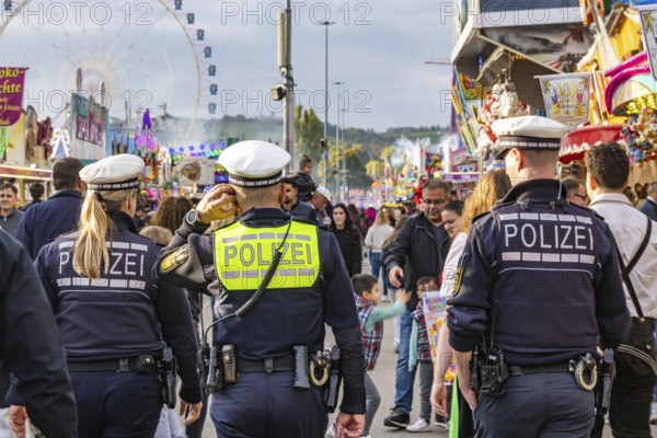Police patrols at the funfair. The 178th Cannstatter Volksfest on the Wasen attracted 4.2 million visitors. The Wasenrummel is one of the most important traditional festivals in Germany. Bad Cannstatt, Stuttgart, Baden-Württemberg, Germany