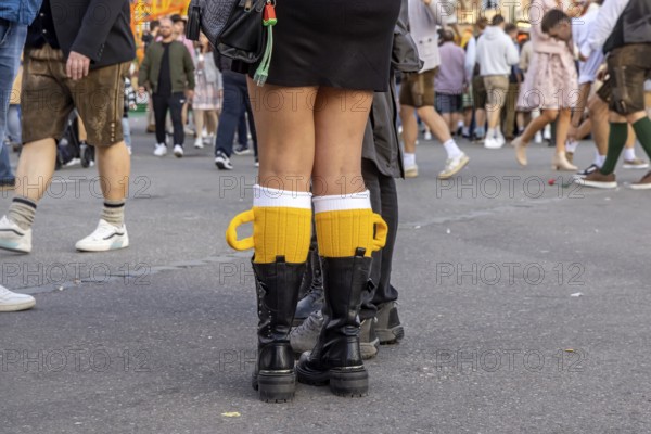 Socks in the shape of a pint of beer. Strange clothing at the Cannstatter Volksfest on the Wasen. Bad Cannstatt, Stuttgart, Baden-Württemberg, Germany