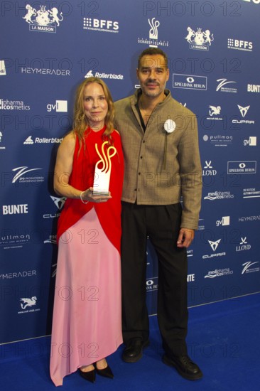 Anneke Kim Sarnau and Michael Klammer present the award for Haley Louise Jones as best actress in a dramatic supporting role, DEUTSCHER SCHAUSPIELPREIS 2025, Red Carpet at PULLMAN BERLIN SCHWEIZERHOF, Berlin, 09.10.2025