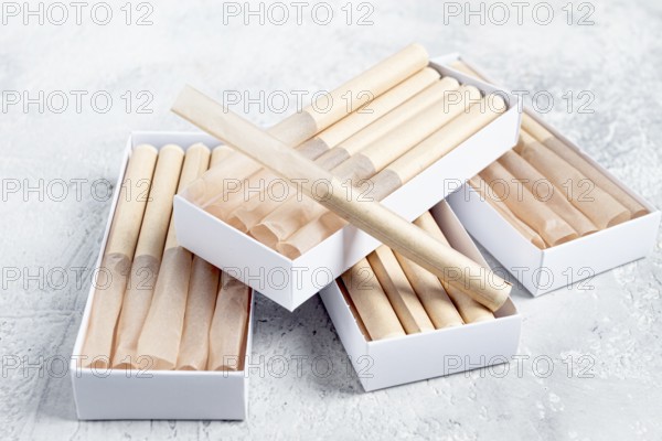 Cigarette casings, packed in boxes, on the table, top view
