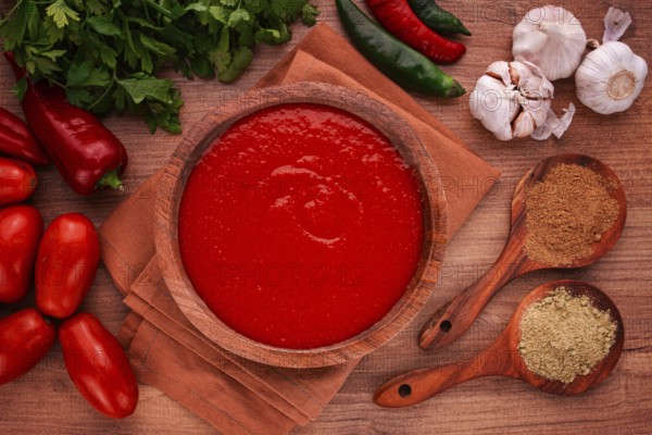 Georgian sauce, Satsebeli sauce, tomato and sweet pepper sauce, with spices, in a wooden bowl, homemade, no people