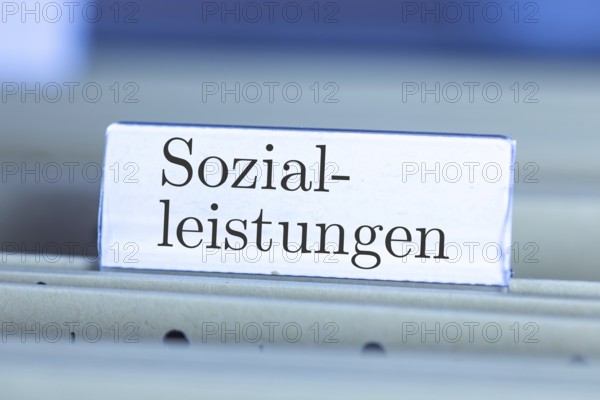 (Photomontage) Sign with the inscription SOZIALLEISTUNGEN on a suspension file index