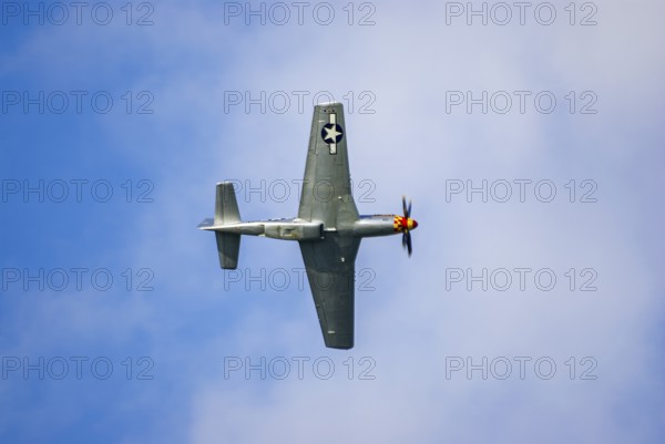 A North American P-51 Mustang of the flying group Flying Bulls, the Nooky Booky IV during an air show at the Rossfeld in Metzingen-Glems, Baden-Württemberg, Germany, for editorial use only