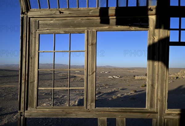View from a former dwelling house into the desert, Kolmanskop, restricted diamond area, Karas region, Namibia