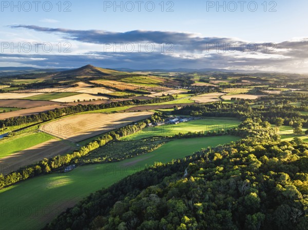 Fields and Farms over River Teviot and Minto Crags from a drone, Roxburghshire, Scottish Borders, Scotland, UK