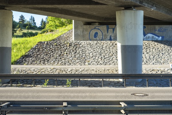 Concrete bridge with graffito in Münsingen on the Swabian Alb, Baden-Württemberg, Germany, for editorial use only