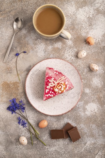 Chocolate cake on brown concrete background, cup of coffee, top view, flat lay, close up