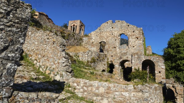 Church of Agia Sophia from the 14th century AD, historical ruins with stone arches and ancient paths, surrounded by natural vegetation, Mystras, Mistra, UNESCO World Heritage Site, Medieval Byzantine ruined city, north-west of Sparta, foothills of the Tyagetos Mountains, Peloponnese, peninsula, Greece