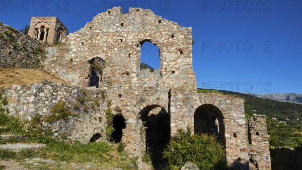 Church of Agia Sophia from the 14th century AD, view of ruins with stone walls and arches in a picturesque landscape under a clear sky, Mystras, Mistra, UNESCO World Heritage Site, Medieval Byzantine ruined city, northwest of Sparta, foothills of the Tyagetos Mountains, Peloponnese, peninsula, Greece