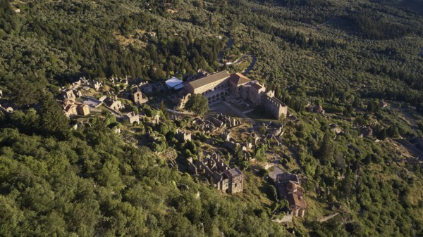 Aerial view of the Byzantine Palace of Mystras, with surrounding ruins in green landscape, Mystras, Mistra, UNESCO World Heritage Site, Medieval Byzantine ruined city, northwest of Sparta, foothills of the Tyagetos Mountains, Peloponnese, peninsula, Greece