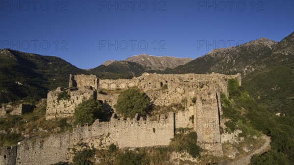Drone image, Byzantine castle on a wooded hill with mountain view, Mystras, Mistra, UNESCO World Heritage Site, Medieval Byzantine ruined city, northwest of Sparta, foothills of the Tyagetos Mountains, Peloponnese, peninsula, Greece