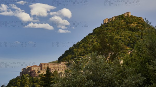Byzantine castle of Mystras, on a wooded hill under a sky with decorative clouds, Mystras, Mistra, UNESCO World Heritage Site, Medieval Byzantine ruined city, northwest of Sparta, foothills of the Tyagetos Mountains, Peloponnese, peninsula, Greece